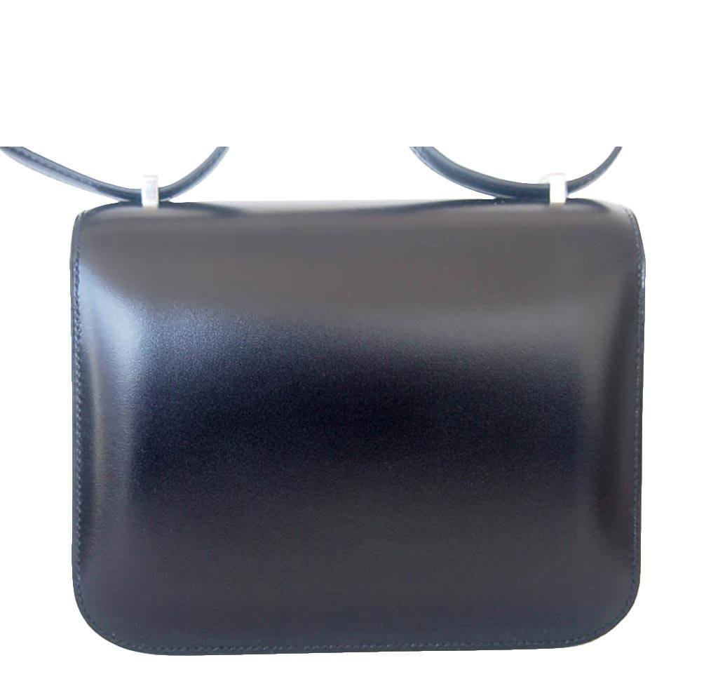 Black leather handbag on a white background