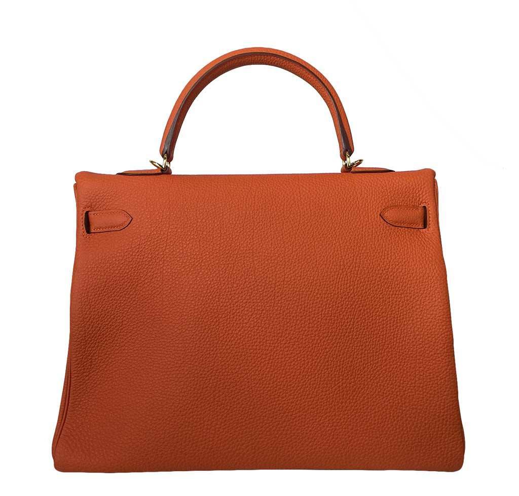 Brown leather handbag on a white background