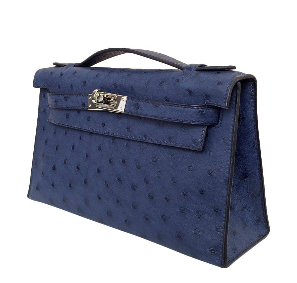 Blue handbag with a textured surface on a white background