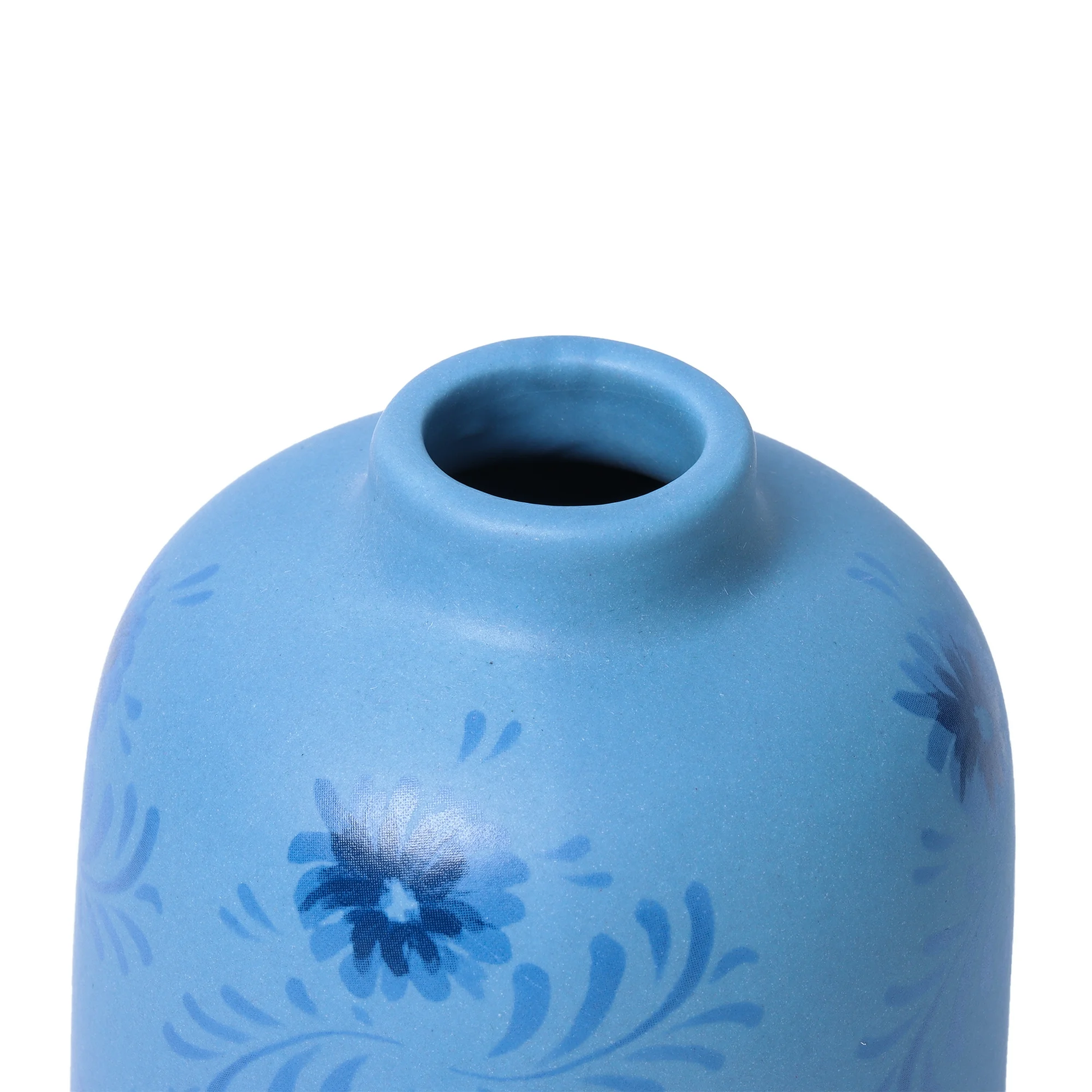 Blue ceramic vase with floral patterns on a white background