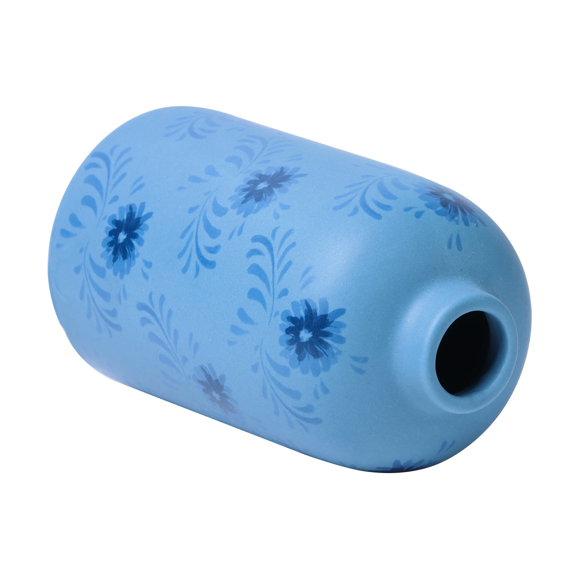 Blue cylindrical object with floral patterns on a white background