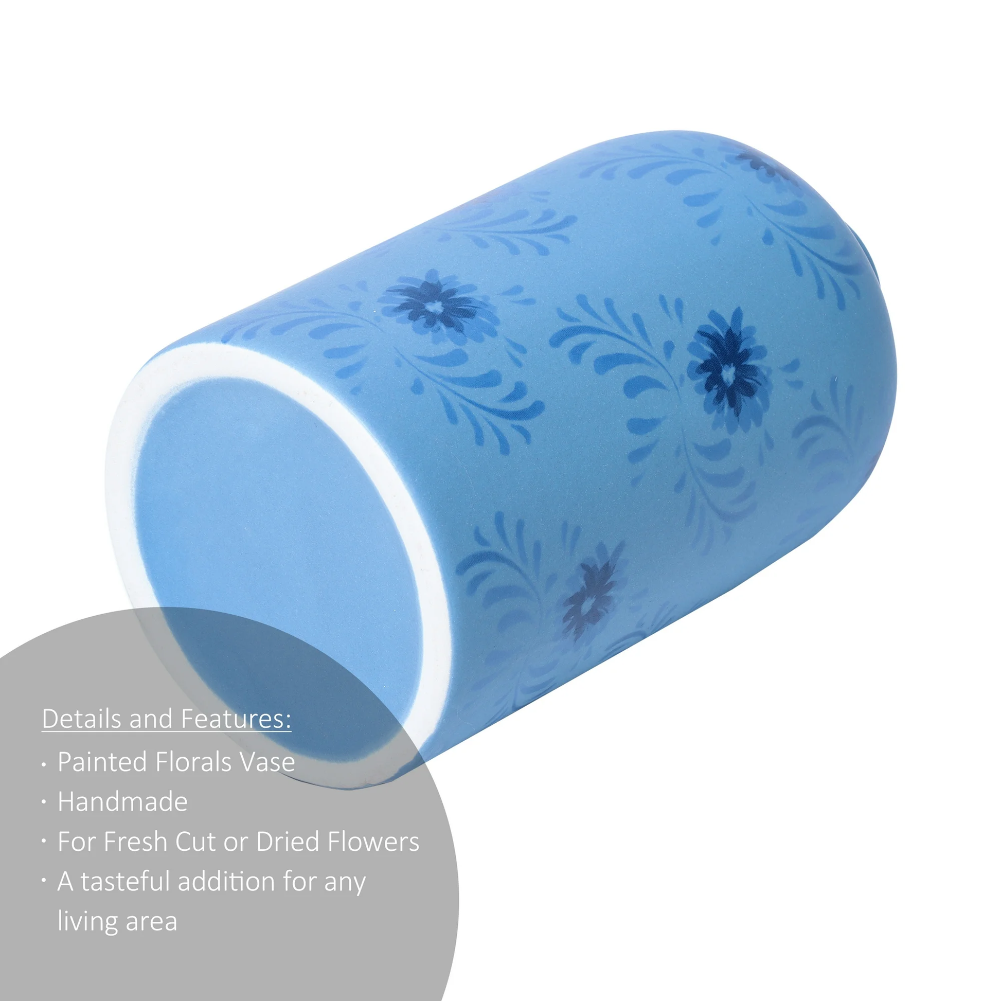 Blue cylindrical vase with floral patterns on a white background