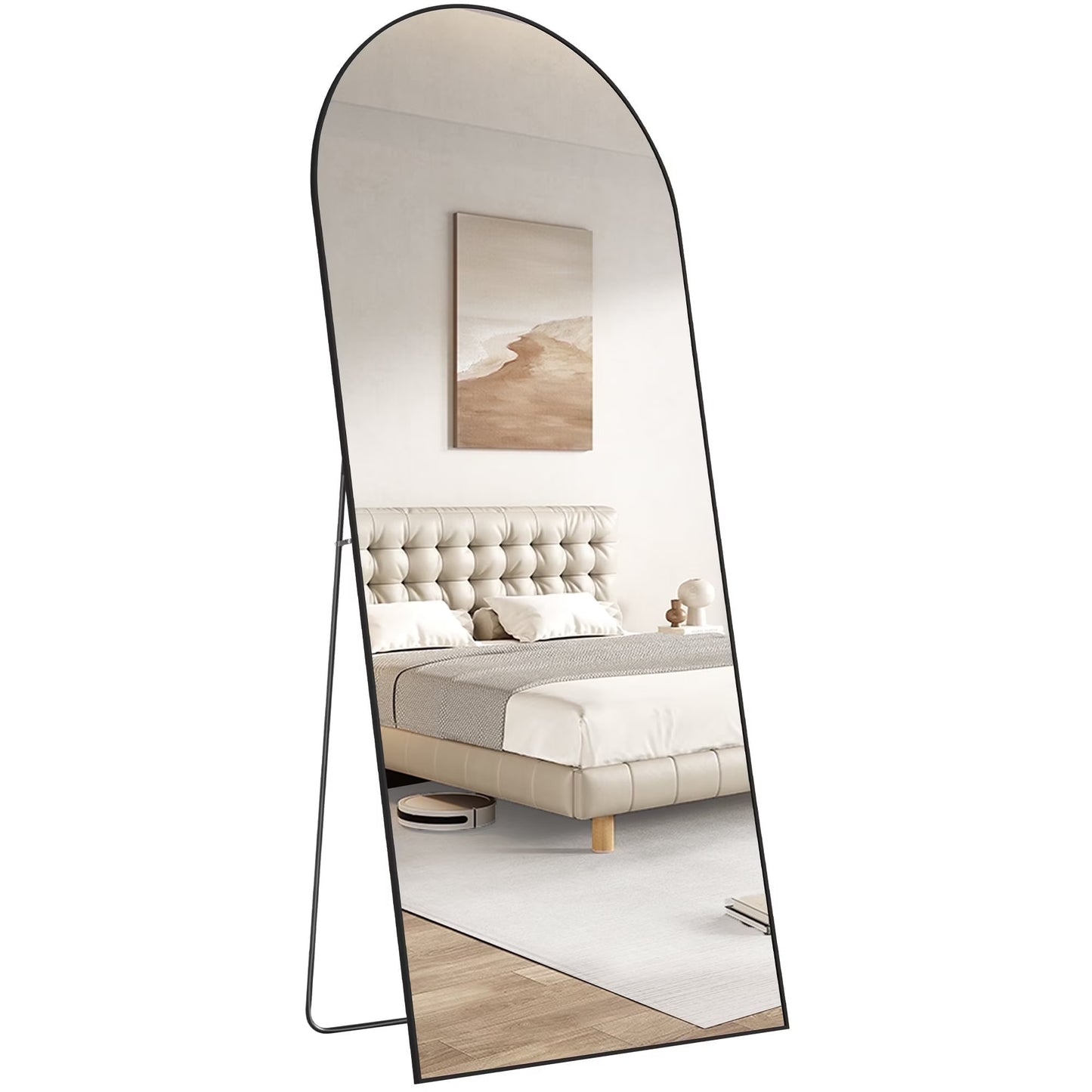 Full-length mirror reflecting a bedroom with a bed and decor.