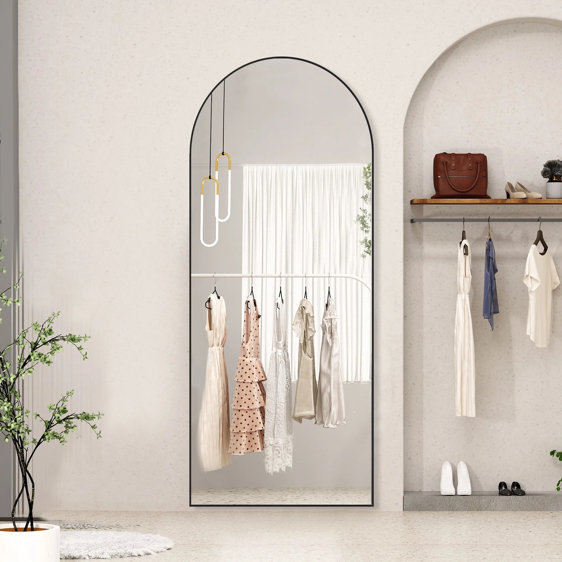 Full-length mirror with clothing display in a room setting