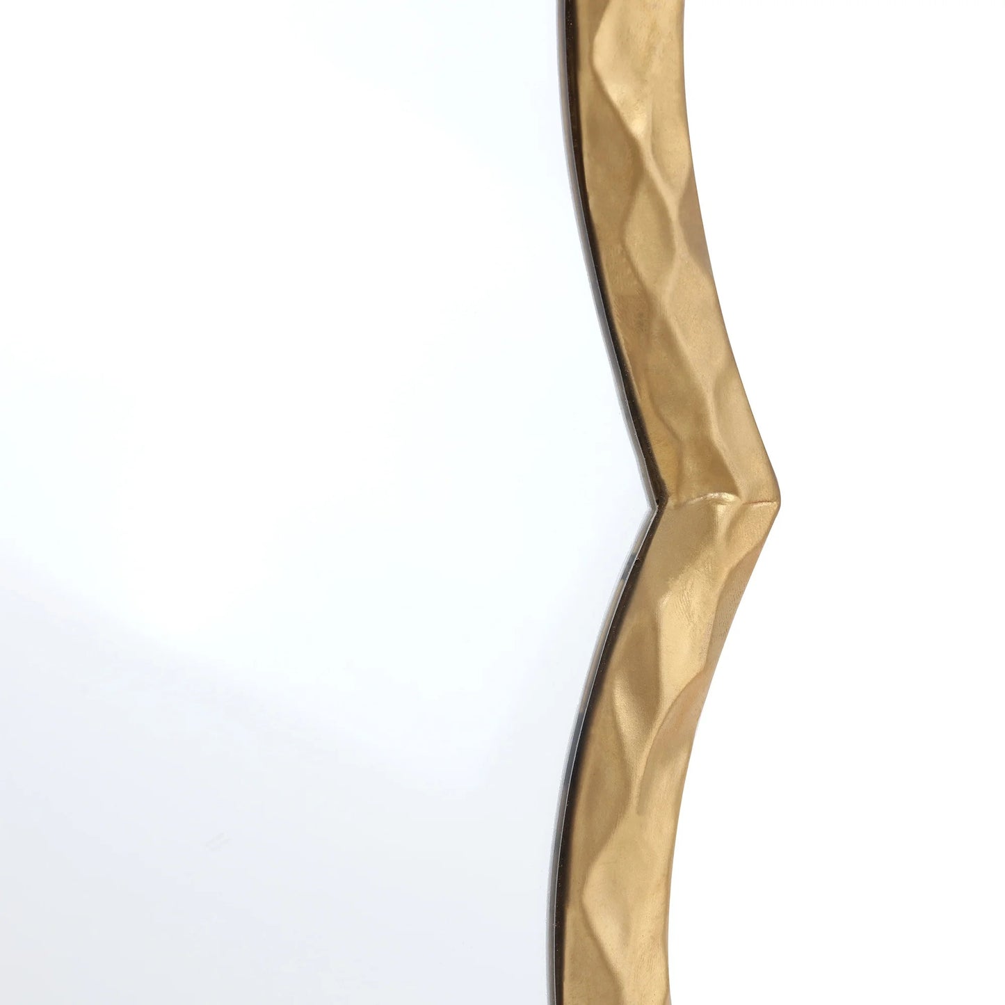 Gold decorative wall piece with wavy design on a white background