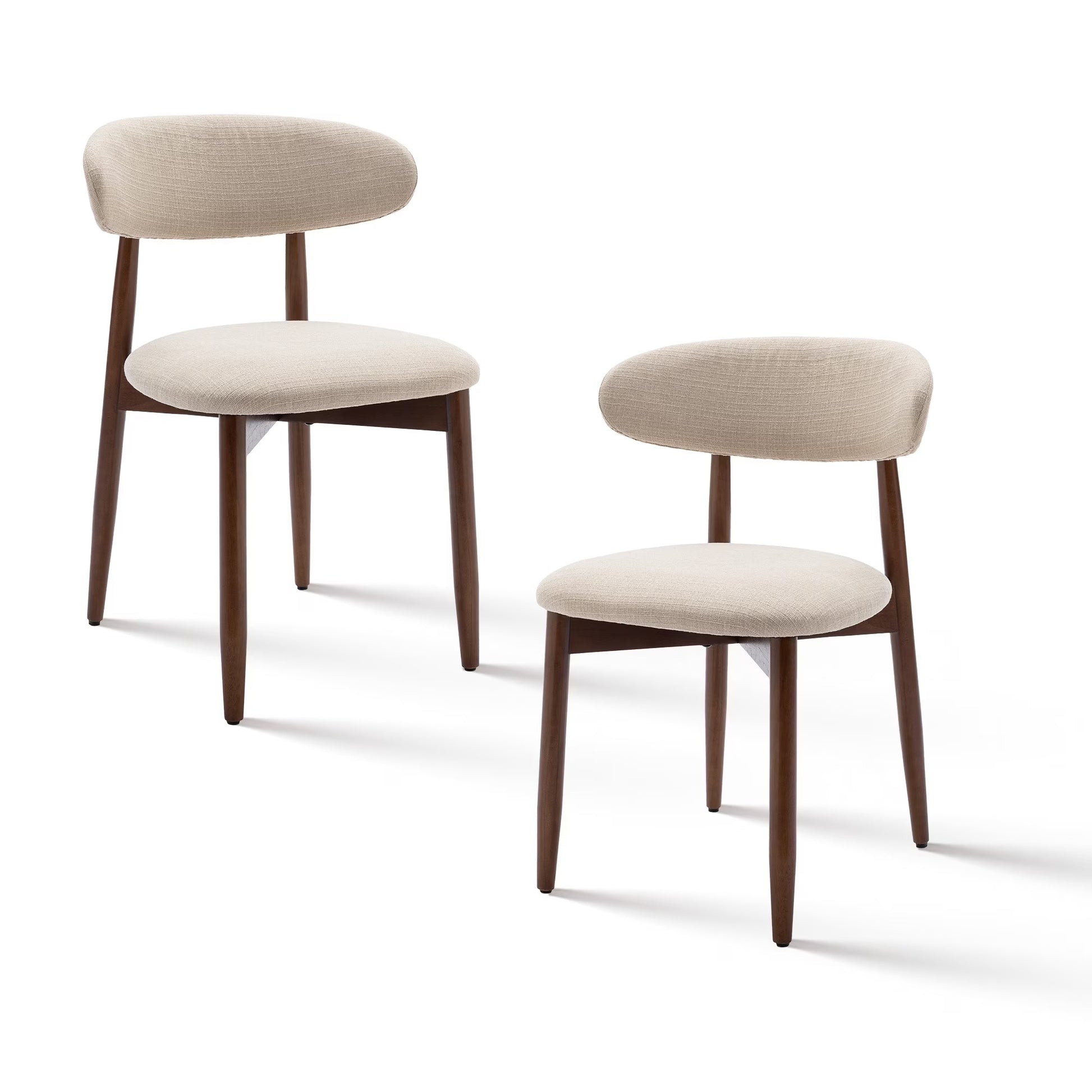 Two beige chairs with wooden legs on a white background