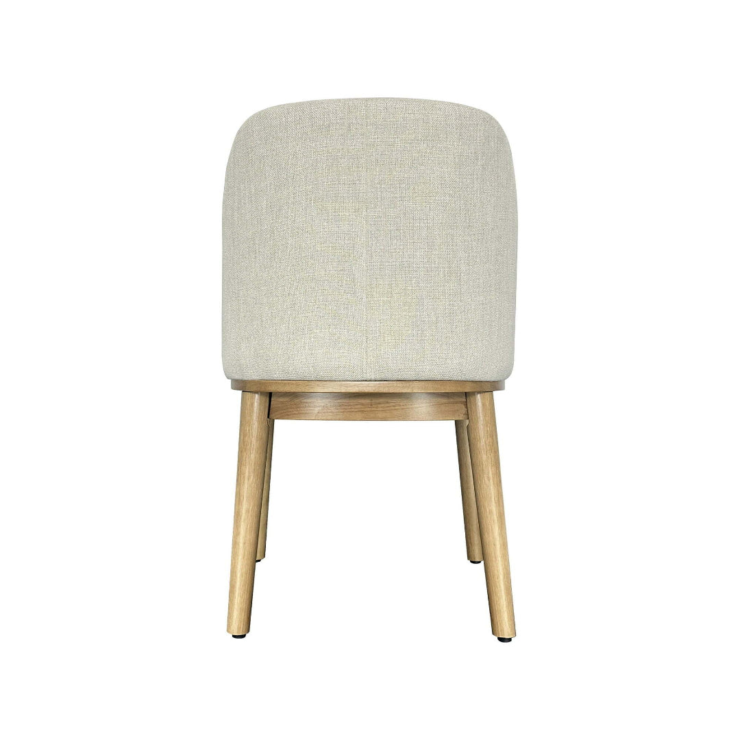 Chair with beige cushioned seat and wooden legs on a white background
