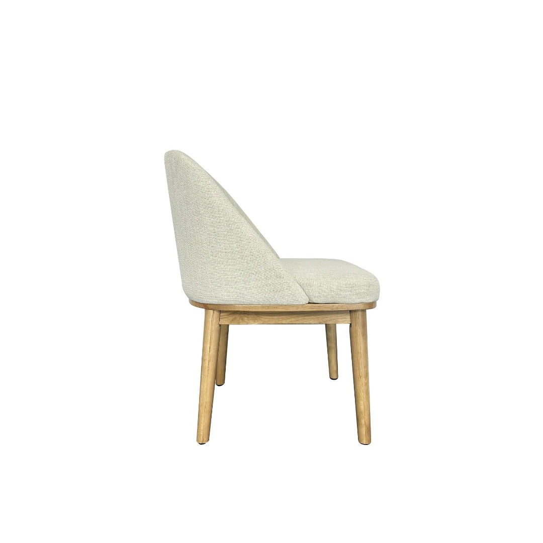 Chair with beige cushioned backrest and wooden legs on a white background